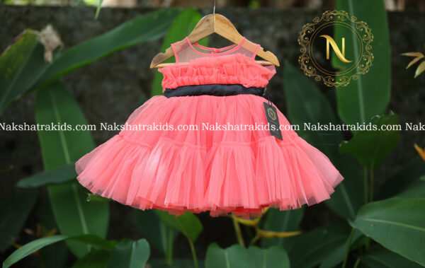 Peach tulle net frock with black sash