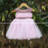 Pastel pink tulle net frock with pastel lavender embroidery fabric on neckline and waistline